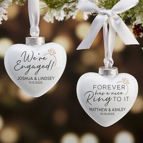 Personalize with any date and namesChoose from multiple phrases  Beautifully crafted of a glistening, ultra-polished porcelainMeasures 3"W x 3"H x 1 1/4"D, unique 3D heart shapes makes for a great addition to any treeIncludes a satin, grey hanger with bow and features an antique, matte silver cap for an elegant finishing touchReverse side of ornament is porcelain whiteImported Soon after their engagement present them with our We're Engaged Personalized Deluxe Heart Ornament; creating a perfect k We're Engaged, Engagement Present, Engagement Ornament, Barbie Gifts, Engagement Presents, Engagement Ornaments, Hunting Gifts, 3d Heart, Military Gifts