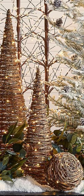 An easy rustic holiday update that’s oh-so-enchanting, the twinkling Light Up Grapevine Cone Tree is woven with natural rattan around a sturdy frame for years of awe and wonder. #rusticchristmas Cabin Ornaments, Tomato Cage Crafts, Grapevine Tree, Rustic Christmas Decorations, Grapevine Christmas, Tomato Cage Christmas Tree, Holiday Planter, Fall Arts And Crafts, Christmas Wreaths Diy Easy