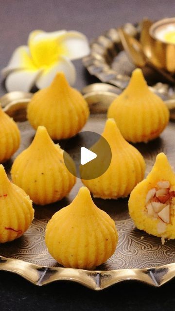 Aarti Madan on Instagram: "10 Mins quick and easy to make stuffed modak that you will love. #AartiMadan  Ingredients For Modak 3 tablespoons ghee/clarified butter 1 cup (250ml) milk 1½ cups (200g) milk powder 3 tablespoons desiccated coconut (optional) 20-22 saffron strands soaked in 4 tablespoons milk 3 tablespoons sweetened condensed milk ¼ teaspoon cardamom/elachai powder For Modak Filling 3 tablespoons cashews 3 tablespoons raisins 3 tablespoons almonds 2 tablespoons mawa modak mixture  Steps In Making  1)In a non stick or a heavy bottom pan add ghee and milk  2)Now heat the milk. Once done add milk powder in two batches and keep stirring it continuously to avoid any lumps. Cook for 2 minutes till the mixture becomes slightly thick and creamy  3)Add desiccated coconut and cook for anot Modak Recipe, Sweets Photo, Desiccated Coconut, Mumbai Food, Types Of Desserts, Indian Dessert Recipes, Indian Desserts, Indian Sweets, Clarified Butter