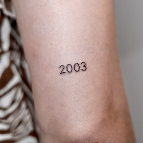 2️⃣0️⃣0️⃣3️⃣ • • • • • #tattoo #tattooist #tattooart #tattooideas #tattooartist #tattoomodel #tattooing #tattoostyle #2003 #date #datetattoo #armtattoo #fineline #finelinetattoo #femalemodel #femaletattooartist #female #nozem #nozemtattoostudio #tattoolove 2003 Tattoo, 3 Tattoo, Tattoos