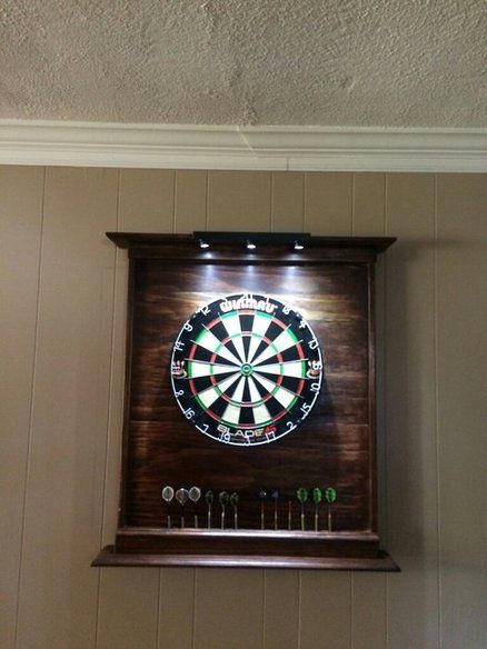 Dartboard cabinet Dart Boards Wall, Dart Board Wall Ideas, Dartboard Cabinet Plans, Dartboard Cabinet Diy, Dart Board Backboard, Dartboard Surround, Dart Board Wall, Dartboard Cabinet, Red Mahogany Stain