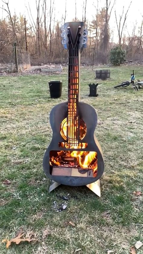 Guitar Fire Pit | GUITAR FIRE PIT...who else wants one of these?!🖐 Find it here (affiliate link)--> https://rstyle.me/+MOdivGf0K_3_aXOTdZBeXg . | By Kitchen Fun With My 3 Sons Blacksmith Power Hammer, Small Wood Burning Stove, Guitar Crafts, Ranch House Decor, Metal Guitar, Vintage Stoves, Kitchen Fun, Camper Living, Fire Pit Backyard