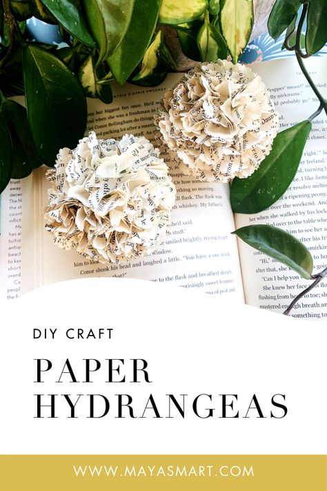 Make delicate hydrangea blossoms out of old book pages with this DIY book craft, a simple project that offers a literary twist on classic paper flowers. Follow three steps to create decor that’s perfect to display around the house, feature as centerpieces at a festive meal, or complete a reading theme for a child’s birthday party. What a pretty way to spotlight literacy and bring a touch of nature into your home! Flowers From Book Pages Diy, Recycled Flowers Crafts, Flowers Made Of Book Pages, Book Page Paper Flowers, Diy Newspaper Flowers, Paper Flowers From Old Books, Book Page Flowers How To Make, Paper Flowers Out Of Book Pages, Flowers Made From Book Pages