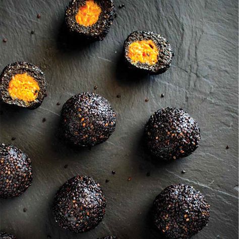 VEGAN | GLUTEN FREE | Makes 12 Balls   ingredients 150g black sesame seeds 150g dates 75g desiccated coconut 3 tablespoons black tahini 1/4 tsp salt  1 tsp vanilla extract 1 tbls maple or brown rice syrup 1 tbl spoon coconut oil 50 g dried mango 50g dried apricots Extra black sesame seeds for rolling   method Place t Black Tahini, Raw Balls, Tahini Recipe, Dried Mango, Seed Balls, Lunchbox Treats, Desiccated Coconut, Black Sesame Seeds, Dried Mangoes