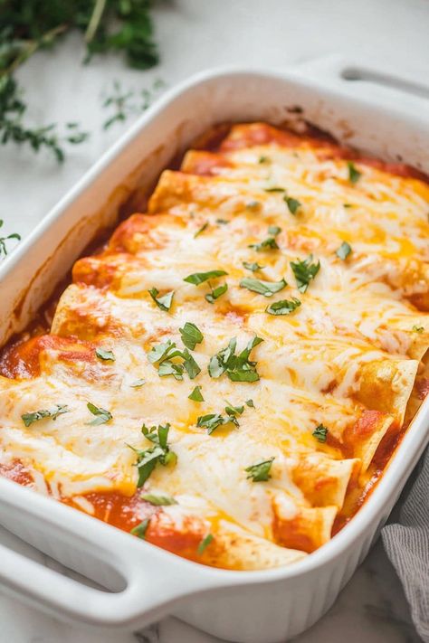 Easy to prepare and utterly satisfying, these homemade cheese enchiladas are a family-friendly dinner or a crowd-pleasing dish for any occasion! Bean And Cheese Enchiladas Easy, Gluten Free Cheese Enchiladas, How To Make Cheese Enchiladas, Cheese Enchilada Recipe, Easy Cheese Enchiladas, Bean And Cheese Enchiladas, Easy Enchilada Recipe, Enchilada Bake, Oaxaca Cheese