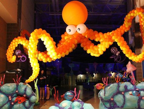 Balloon octopus decoration for under the sea themed fall formal dance. Built with nearly 1000 balloons !! Scuba Theme Vbs Decorations, Under The Sea Formal Theme, Under The Sea Parade Float Ideas, Under The Sea Glow Party, Under The Sea Hoco Float, Under The Sea Float Parade, Under The Sea Stage Decorations, Under The Sea Float, Under The Sea Dance Decorations