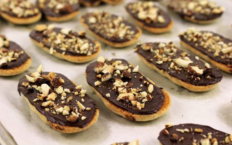 <p>These crispy almond cookies are painted with a layer of dark chocolate, studded with nuts and pretty much perfect for dipping in any beverage you find cookie-worthy. The cookie itself is a buttery almond-based biscuit similar to a shortbread or a Geneva. </p> Vegan Copycat, Pepperidge Farm Cookies, Linzer Cookie, Crisp Cookies, Linzer Cookies Recipe, Spritz Cookie Recipe, Easy To Make Cookies, Chocolate Covered Cookies, Farm Cookies