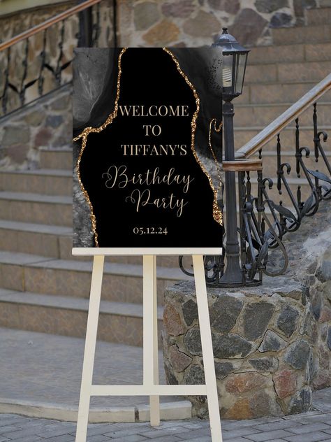 Editable black and gold birthday welcome sign, perfect for your next birthday party or birthday dinner. This welcome to sign can be edited yourself using Canva. Print at home or take completed file to your local print shop and have them print. Print size is 18x24.  All the wording is editable. Details: black and gold birthday party welcome sign, with black and gold agate design. Wording can be changed to accommodate all the great milestone birthdays such as 18th birthday 21st birthday, 30th birthday, 40th birthday, 50th birthday, 60th birthday and so on! Can easily be edited for a baby shower welcome sign, wedding welcome sign, bridal shower welcome sign and more! HOW IT WORKS: ♥ Once purchased, you will receive a link that will take you to Canva.com where you will be able to edit the temp 70 Birthday Party Ideas Black And Gold, Black And Gold Party Decorations Birthday Sweet 16, Black And Gold 90s Party, 23 Birthday Ideas Party, Welcome To 60th Birthday Sign, 60th Birthday Ideas Black And Gold, Black And Gold Party Decorations Outdoor, 21st Birthday Black And Gold Theme, Black And Gold 75th Birthday Ideas