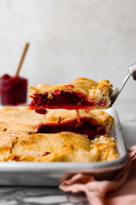 Cherry Slab Pie is an American classic made to serve a crowd! This recipe uses a tender crust that surrounds sweet, juicy cherry pie filling. Peanut Butter Pinwheel Candy, Pinwheel Candy Recipe, Cherry Slab Pie Recipe, No Roll Pie Crust Recipe, No Roll Pie Crust, Pinwheel Candy, Cherry Slab Pie, Thanksgiving Desserts Pumpkin, Triple Berry Pie