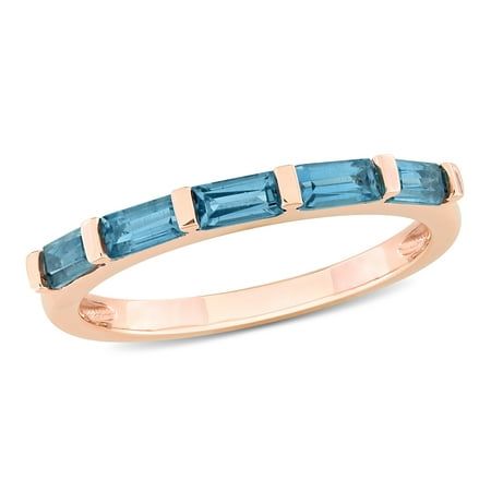 Discover the captivating allure of the Miabella Women's 1 CT TGW Blue Topaz - London Fashion Ring, meticulously designed in the enchanting embrace of 10k pink gold. This fashion-forward ring celebrates the mesmerizing beauty of the blue topaz-London gemstone, infusing each moment with a touch of elegance and sophistication. The gemstone's unique hue adds a captivating twist to the classic blue topaz, making this ring a truly distinctive piece. Its stackable design empowers you to effortlessly cr Heart Halo Ring, London Topaz, Mesmerizing Beauty, Topaz Color, Gold Halo, Rose Gold Band, Citrine Gemstone, Emerald Engagement Ring, Rose Gold Jewelry