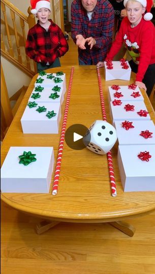 503K views · 3.4K comments | Christmas Family Dice Roll Game 🎁 | Christmas Family Dice Roll Game 🎁  Kids, Dad, adn family play diy dice roll party game with Christmas bows and candy. Perfect game for family Christmas... | By Benson Bros | Roll the dice. Come on. Oh you got two which means you get this two or this two. Come on up here. Alright. What did you get? Oh. A bowl with a big present on the. Oh my goodness. Go for it. Come on. Get. Oh, number 5. Which means you get this five, Orius. Okay, what's your prize? What is it? Oh, Cheetos. Cheetos. It's your turn and guys, one of these presents has a bad punishment inside. Okay, one of the presents has a bad punishment. So, you don't want to get that one. Oh. Two green, a seam stick. You going green sticks? Picking the green one? Oh. It's Christmas Stocking Guessing Game, Christmas Games With Dice, Diy Christmas Games For Family, Christmas Dice Games, Christmas Games For Family With Prizes, Fun Christmas Games For Kids, Benson Bros, Grinch Stocking, Christmas Dice Game