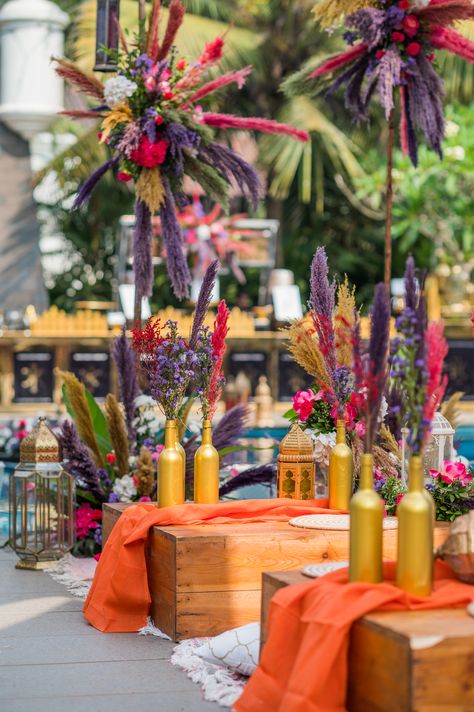 A boho themed mehendi with morroccan lanterns, with a pop of vibrant reds and pinks🌷 Dream Destination Wedding, Boho Theme, Fabric Accessories, Destination Weddings, Goa, Vibrant Red, Table Centerpieces, Event Decor, Lanterns