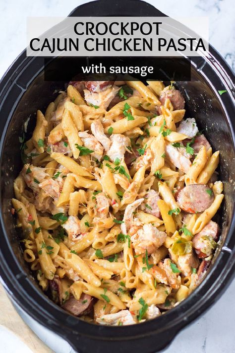 This Slow Cooker Cajun Chicken Alfredo is full of chicken, peppers, andouille sausage, and a creamy homemade alfredo sauce made right in your crockpot. | www.persnicketyplates.com Cajun Chicken And Sausage Pasta Crockpot, Crockpot Cajun Sausage Pasta, Chicken Sausage Pasta Crockpot, Sausage Alfredo Pasta Crockpot, Cajun Alfredo Pasta Crockpot, Recipes That Use Andouille Sausage, Easy Cajun Chicken Pasta Crockpot, Slow Cooker Cajun Pasta, Cajun Pasta Crockpot