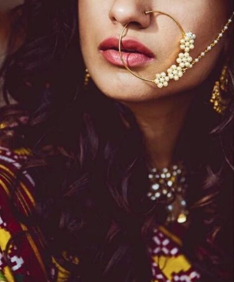 A statement minimalist Rajasthani nath crafted from pearls encrusted in gold to complement the evergreen Indian Bride | source: dil_di_gal_couture instagram Fashion Photography Indian, Indian Nose Rings, Nose Jewels, Nath Nose Ring, Bridal Nose Ring, Photography Indian, Bridal Jewelry Sets Brides, Bride Jewelry Set, Indian Bridal Jewellery