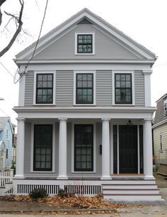 The house color is Benjamin Moore Graystone, the trim is Silver Chain. The door is plain Black which seemed to best match the Marvin windows which are aluminum clad. Aqua Shutters, Exterior Renovation Before And After, Greek Revival Exterior, Aluminum House, Black Window Frames, Porch Lights, Urban Cottage, Gray House, House Trim