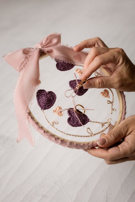 This handcrafted crochet ring holder adds a touch of rustic charm to your autumn country wedding.  

 Ditch the commonplace ring pillows and choose a personalized piece that transcends the fleeting nature of your special day.  This beauty combines the warmth of crochet with the elegance of embroidery, creating a timeless keepsake you'll cherish for years to come. Easily adapt it to your wedding venue's style, and afterwards, display it proudly on your wall or frame it as a cherished memory of your wedding celebration.  
.#embroideredwedding #DIYembroidery #handmadewedding #embroideryinspiration #weddingcrafts Appliques Au Crochet, Rustic Wedding Ring, Traditional Wedding Rings, Crochet Appliques, Wedding Ring Holder, Crochet Embellishments, Wedding Kit, Rustic Wedding Rings, Crochet Rings