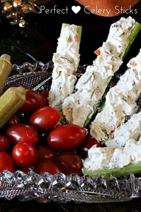 Perfect stuffed celery appetizer recipe. Celery is the perfect vessel for a mixture of cream cheese and chopped green pimento-stuffed olives. Throw in some crunchy walnuts and some blue cheese and you've got an appetizer full of memories. via @lannisam Stuffed Celery Sticks, Stuffed Celery, Holiday Buffet, Cream Cheese Appetizer, Celery Recipes, Celery Sticks, Popular Appetizers, Catering Display, Appetizers Recipes