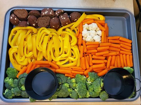 I was asked to bring a veggie tray for a little boy's birthday party with a construction theme.  I searched Pinterest hoping to find something and was shocked when I couldn't!  I came up with this design on my own.  The black dishes used for tires later were filled with veggie dip at the party.  Pumpernickel bread was sliced up and represented dirt in the dump truck.  Baby carrots, yellow bell pepper, broccoli and cauliflower made up the rest of the truck. Everyone loved it! Truck Veggie Tray, Construction Birthday Party Food, Construction Theme Birthday Party, 2nd Birthday Party For Boys, Construction Theme Party, 2nd Birthday Boys, 2nd Birthday Party Themes, Construction Birthday Parties, Trucks Birthday Party