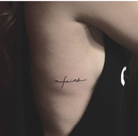 Faith side tattoo Faith Tattoo Side Rib, Side Script Tattoo, Faith Tattoo Ribs, Faith Script Tattoo, Faith Rib Tattoo, Script Side Tattoos Women, Rib Script Tattoo Women, Rib Script Tattoo, Tiny Script Tattoo