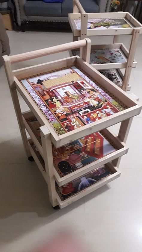 These are customized handmade wooden tea trolleys in raw, polished or chalk painted. Its sealed with resin. Client can also select theme (Ancient Egypt, Mughal art, Still life, Jungle or collage of own pictures) and wood (sheesham, pine, teak). Fixed and foldable option available. Tea Trolley Wooden, Food Cart Diy, Diy Food Cart, Kitchen Rolling Cart, Organization Small Space, Serving Station, Cooking Station, Home Kitchen Design, Storage Utility