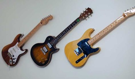 Guitar Hangers Wall, Hang A Guitar On The Wall Diy, Wall Mounted Guitars, Wall Hanging Guitar, Ways To Hang Guitars On Wall, Hang Guitars On Wall Ideas, How To Hang A Guitar On The Wall, Guitar Wall Hanger Ideas, Hanging Guitars On Wall Ideas