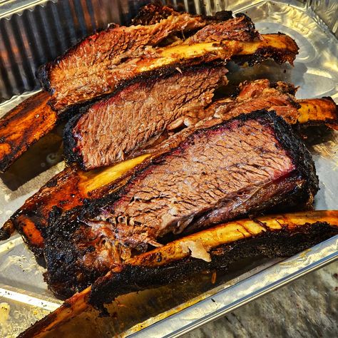 Smoked Dino Ribs (aka beef ribs) are considered by many to be the greatest bite in BBQ. Seasoned with our new Open Fire Smokey Road Rub and then slowly smoked over hickory wood, this meat will be fall off the bone tender. Visually appealing and mouthwateringly delicious, this BBQ all-star is surprisingly easy to pull off. Follow this recipe and any BBQ beginner will be able to impress the toughest critics. Hickory Wood, Open Fire, Beef Ribs, Open Fires, A Dinosaur, The Bone, Let Me, Meat, Road