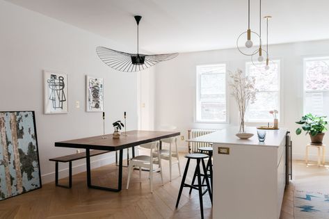 A view of the open kitchen/dining area with a Constance Guisset Vertigo Pendant Lamp. Townhouse Modern, Vertigo Pendant Light, Mid Century Bedroom Decor, Simple Beach House, Vertigo Pendant, Modern Cabinetry, Townhouse Renovation, Lavatory Design, Pink Living Room Decor