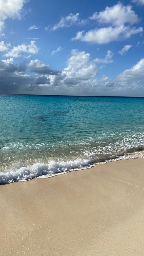 Beach photo with sand and clear blue water on a sunny day. There are clouds out but the blue sky is visible. Turks And Caicos Aesthetic, Grand Turks, Island Aesthetic, Waves Painting, Christmas Cruise, Ocean Waves Painting, Grand Turk, Christmas Cruises, Turks Caicos