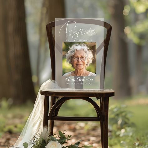 The "Reserved" Memorial Photo Sign is an ideal way to pay tribute to your loved ones on your wedding day. This customizable frosted acrylic plaque acts as both a heartfelt memorial and an elegant decor element. Perfect as a sympathy gift or wedding remembrance, it beautifully honors those who will always hold a special place in your heart. In Loving Memory Wedding Dress, Memory Tree Wedding Photo Displays, Memory Table For A Love One, Memory Table Overstock, Memorial Service Picture Table, Honoring Loved Ones At Wedding Tree, Memory Table Wedding Display With Pictures, Wedding Candles For Those In Heaven, Remembering People At Wedding