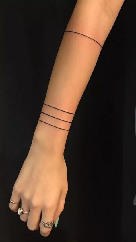 band tattoo Dainty Arm Band Tattoos For Women, Simple Arm Band Tattoo, Band Tattoos For Women, Geometric Wrist Tattoo, Arm Ring Tattoo, Tattoos For Women Minimalist, Arm Cuff Tattoo, Thigh Band Tattoo, Thigh Band