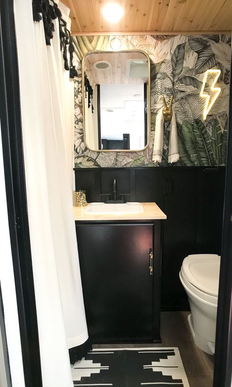 RV Makeover with Serious Boho Vibes — Troop Nashville Camper Remodel Black Cabinets, Rv Bathroom Remodel Wallpaper, Black Cabinet Rv, Rv Remodel Black Cabinets, Black Cabinets In Rv, Black Rv Bathroom, Black Rv Interior, Farmhouse Motorhome, Campers Remodeled