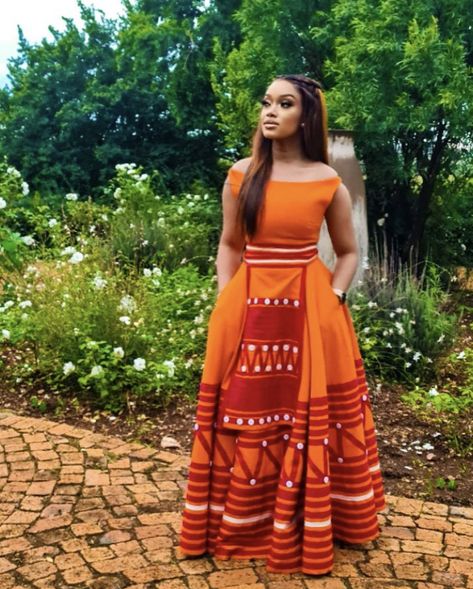 Xhosa Lobola Attire, Umbaco Xhosa Dresses Modern, Modern Traditional Wedding Dress African, Traditional Xhosa Wedding Attire, Traditional Dresses Modern South African Traditional Dresses, Orange Shweshwe Dresses, Mbhaco Designs, Xhosa Traditional Attire Women, Umbaco Xhosa Dresses