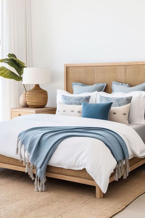 Beach House Interior Coastal Cottage Blue And White, Rattan Headboard Bedroom Decor, Beige Coastal Bedroom, Blue White Apartment, Beach House Beds, Coastal Bedroom Headboard, Blue And Rattan Bedroom, Cream And Blue Bedding, Coastal Bedroom Modern