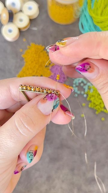 Capital City Beads (Christina) on Instagram: "Triangle Frame Fringe Earrings! I haven't made a pair of these for a while and I needed some earrings to match my nails!!! 😆💅 FREE ~ Full length tutorial on our YouTube Channel! MATERIALS (Shop now at CapitalCityBeads.com) • Triangle Frame With Loop • 3mm Firepolish • Size 11/0 & 8/0 Seed Beads • Nymo B Thread • Size 12 Beading Needle • Earwires Comment for a link to the colors and supplies I used in this video. 🤩🙋‍♀️ .. This design is free fo Triangle Beaded Earrings Tutorial, Brick Stitch Hoop Earrings Tutorial, Diy Beaded Fringe Earrings, Free Seed Bead Fringe Earring Patterns, Beaded Fringe Earrings Tutorial, Triangle Beaded Earrings, Seed Bead Tutorial For Beginners, Diy Beaded Earrings Tutorials, Beadwork Patterns Free Seed Bead Tutorials