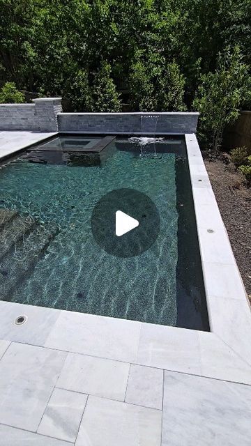 Luke Burbank/Artistic Pools Inc. on Instagram: "15'x24' rectangle with flush spa and ice white marble coping and decking and black marble pebble-tec in Atlanta. #luxurypools #artisticpools #gapoolbuilder #swimmingpool #pool #poolman #poolmanluke #pools #poolguy #swimmingpools #atlanta" Black Swimming Pool Ideas, Sandblasted Marble Pool Deck, Black Pools Swimming, Dark Pool Aesthetic, Marble Pool Deck, Rectangle Pool With Spa, Pool Black And White, Pool Coping Ideas, Black And White Pool