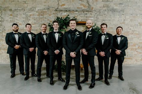 Men’s Wedding Black Suits, Black Tux Winter Wedding, Classic Black And White Groomsmen, Groom All Black Suit With Groomsmen, Winter Wedding Colors Black, Black And Green Wedding Groomsmen, Groomsmen Attire For Winter Wedding, Black Suit Wedding Groomsmen Color Schemes, Black Tux Fall Wedding