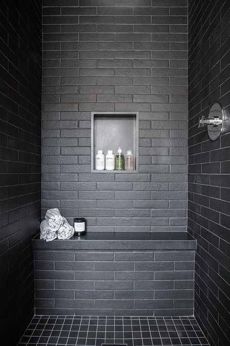 A black tiled shower bench fitted with a black quartz top sits on black gird floor tiles and against black brick wall tiles finished with a black niche. Matte Bathroom Tiles, Black Matte Bathroom, Matte Bathroom, White Wood Paneling, Black Subway Tiles, California Beach House, Black Brick Wall, White Oak Hardwood Floors, Black Brick