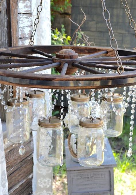 Wagon Wheel Garden, Wagon Wheel Decor, Mason Jar Light Fixture, Chandelier Diy, Jar Chandelier, Mason Jar Chandelier, Wagon Wheels, Old Wagons, Wheel Decor