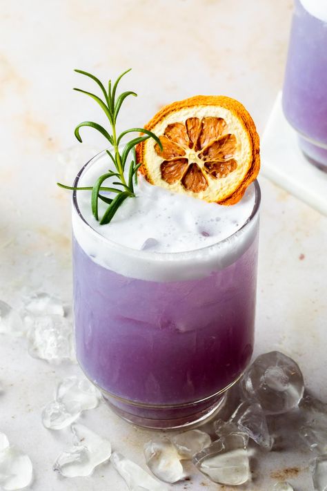 This unique gin gets it's purple-blue hue from the butterfly pea flowers used in its distillation process and it makes for some gorgeous cocktails. This simple Empress gin cocktail is a vibrant take on a gin sour infused with rosemary simple syrup and dry shaken for a creamy foam finish. Empress Gin Cocktail, Gin Sour Recipe, Empress Gin, Homemade Beef Stew Recipes, Girls Night Drinks, Summer Mocktails, Butterfly Pea Flowers, Cocktail Gin, Gin Sour