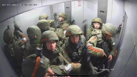 Photo of Russian troops supposedly stuck in an elevator is going viral John Spencer, Masked Man, Military Men, The Roof, Office Building, Armed Forces, A Team, Soldier, Roof