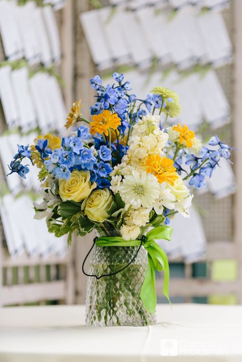 Something blue, with sunny yellow and bright greens. © Carolina Photosmith Styled by @Loluma Wedding Planning + Design Navy Blue And Yellow Flower Arrangements, Light Blue Yellow And Green Wedding, Yellow And Periwinkle Wedding, Blue White Yellow Flower Arrangements, Blue Yellow Green Flower Arrangements, Blue Yellow Centerpieces, Blue Yellow And White Flower Centerpieces, Blue And Yellow Wildflower Wedding, Light Blue And Yellow Wedding Flowers