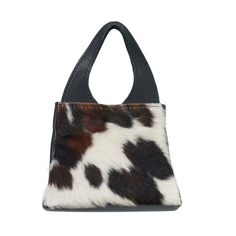 Every wardrobe deserves a statement handbag and the OMG! A handbag could be just the one for you. Crafted from the finest Serengeti cowhide leather with a flamboyant front made of hair-on calf hide, this bag exudes bold elegance. But perhaps, the spacious interior with excellent organizational capabilities is the true highlight of this bag. Featuring two inner pockets and a zipper pocket, this handbag is a functional travel/everyday bag with a major OMG factor. Dimensions: ● Measures 12" from to Cowhide Bags Handbags, Statement Handbag, Sporty Spice, Cowhide Bag, Chic Outfit, Patterns In Nature, Cute Bags, Everyday Bag, Black Handbags