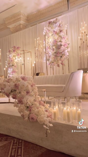 Loza Events on Instagram: "Paradise vibes for Nadia & Wallie at @gardencityhotel. . . . #weddingstyle #pinkandwhite #weddingflowers #weddingdecor #metalframes #reception #receptiondecor #sweethearttable #backdrop #weddingbackdrop" White And Gold Wedding Stage Decor, White Glamorous Reception Sets, White And Gold Nikkah Decor, Loza Events, Nikkah Partition Decor, Nikah Partition Decor, Chaturthi Decoration, Pineapple Cupcake, Bride And Groom Table