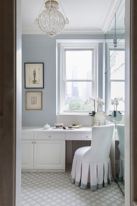 White and blue master bathroom finished with blue grasscloth wallpaper surrounding a window above a built-in makeup vanity topped with white quartz counters. Bathroom Master Vanity, Cece Barfield, Master Vanity, Medieval Garden, White Vanity Mirror, His And Hers Sinks, White Quartz Counter, Vanity Counter, Blue Window