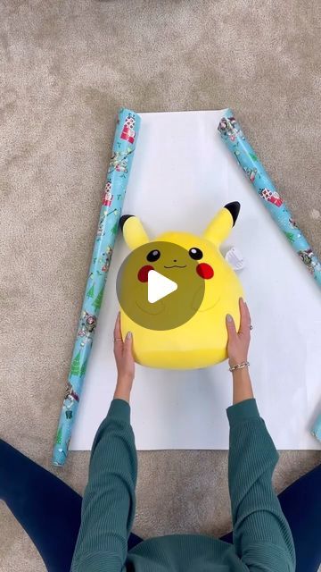 How To Wrap A Door Mat As A Gift, How To Gift Wrap A Squishmallow, Wrapping Sweater Gift, How To Wrap Pillows For A Gift, How To Wrap A Squishmallow, How To Wrap A Blanket As A Gift, Decorated Gift Bags, House Tips, How To Wrap