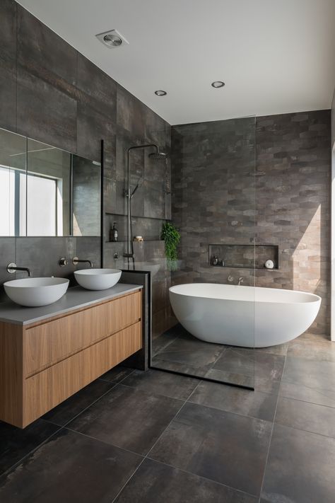 This is the master bedroom ensuite bathroom  on the top floor in this three level inner city townhouse. Fully tiled walls, custom vanity with double vessel basins and aged iron tap ware, mirror cabinet for more storage. Beautiful big walk in shower/ wet room end of the bathroom with freestanding oval shaped bath.  #ledmirror #bathroomdesign #renovation #vesselbasin #timbervanity #bathroom #tapware #apartment #walkinshower #freestandingbath #modern Modern Ensuite, Fully Tiled Bathroom, Wet Room Bathroom, Bathroom Freestanding, Bathroom Inspiration Modern, Master Ensuite, Ensuite Bathrooms, Ensuite Bathroom, Casa Container