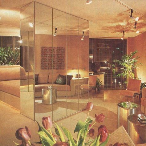 #TBT  The epitome of style in 1982, this floor-to-ceiling mirror setup was believed to give the feeling of more space, and also hid cabinetry and an entertainment center.  You might notice the angled lighting created a dramatic effect and helps point your eyes where the interior designer wanted you to focus.  #UnitedRealEstateChicago #RealEstate #RealEstateForSale #RealEstateExpert #CreditRepair #CreditRepairman #Homes #Chicago #GlenEllyn #GlendaleHeights #Wheaton #CarolStream #Bloomingdale 80s Living Room, 1980s Interior Design, 1980s Interior, 90s Interior, 80s Interior Design, 80s House, 80s Bedroom, San Myshuno, 80s Home