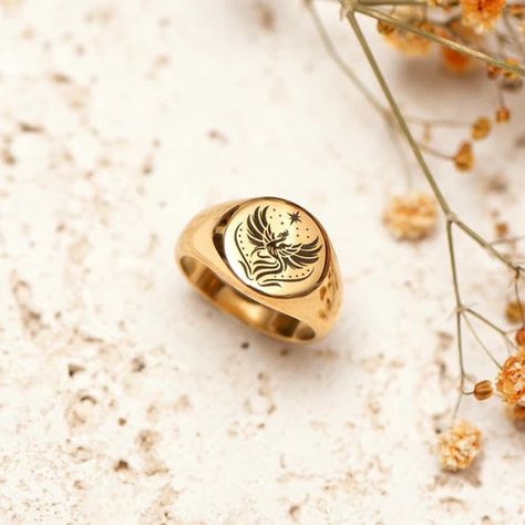 A bold and powerful ring that symbolizes strength and rebirth 🔥✨ Rise from the ashes and embrace your inner phoenix. Let this signet ring remind you of your resilience and unstoppable spirit. . . . . . #phoenixring #risefromashes #glamherjewelry #empowermentjewelry #statementring #luxurystyle #giftsforher #jewelry #luxury Rise From The Ashes, Signet Ring, Statement Rings, Gifts For Her, Luxury Fashion