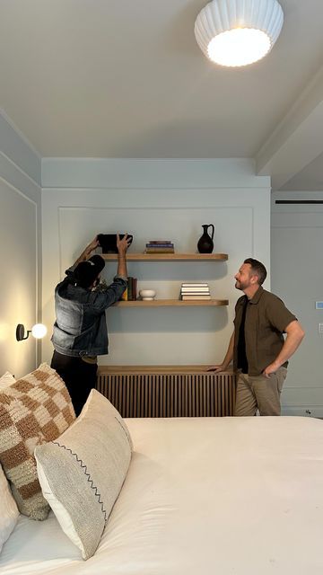 Barry + Jordan 🤎 on Instagram: "Some necessary elements in a room aren’t always the most attractive, like bulky radiators and ugly HVAC units. At #dreaminfortgreene , the second floor HVAC unit did not fit with the sanctuary vibes of the primary suite. So, we got creative with some open shelving from @shelfology & a custom designed radiator cover! First, we designed a radiator cover with @thebuildwithethan and mounted it over the HVAC. Next, we picked out some Aksel shelves to pair with it. We selected two shelves and spaced them above the cover to create a bookcase effect.  Check out our latest blog post (link in bio) for the full story behind this space and discover how we blend storage, display, and utility to make every space feel like a dream ☁️ #brownstoneboys #interiordesign #sh Primary Suite, Hvac Unit, Storage Display, Radiator Cover, Open Shelving, Second Floor, Blinds, Blog Post, Two By Two