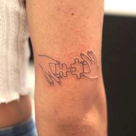 Jigsaw Tattoo Puzzle Pieces, Jigsaw Piece Tattoo, Puzzle Piece Tattoo Family, Puzzle Tattoo Family, Special Needs Tattoo, Tattoo Of Hands Holding Something, Puzzle Tattoo Design, Tattoo Puzzle Piece, Puzzle Pieces Tattoo